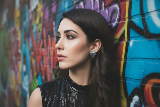 B*tch Heart Stud Earrings lifestyle shot - model wearing earrings